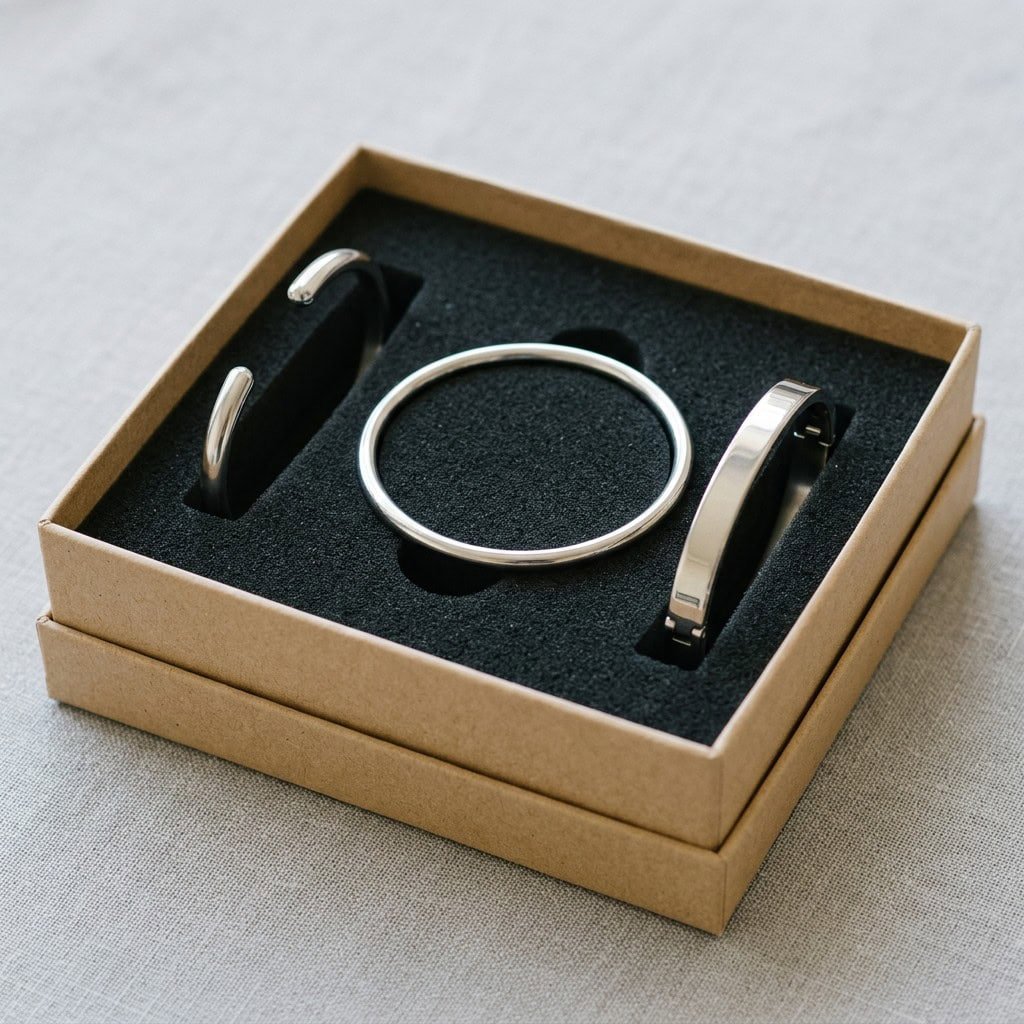 Stainless steel bangles secured in a fitted gift box insert