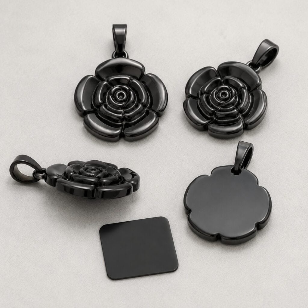 Black PVD rose pendants showing readable relief and edge coverage